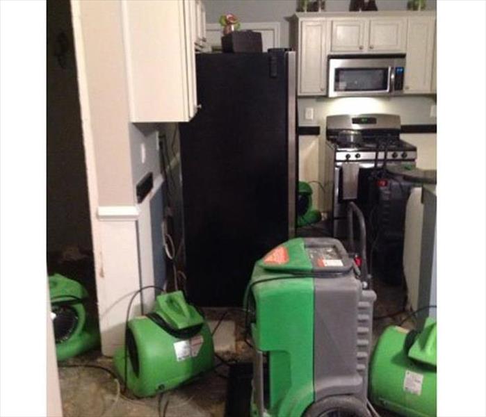 dehu and air movers in a kitchen, no base cabinets