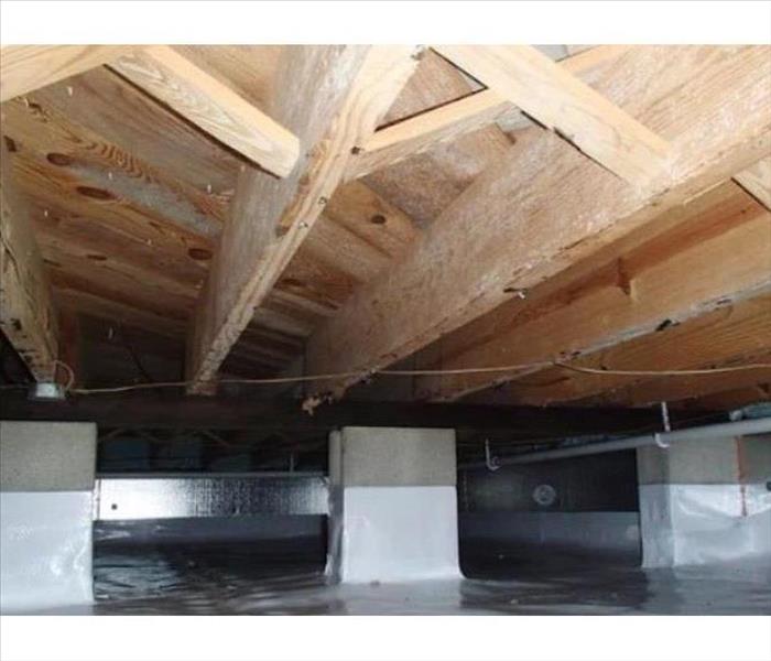 vapor barrier attached to piers in crawlspace